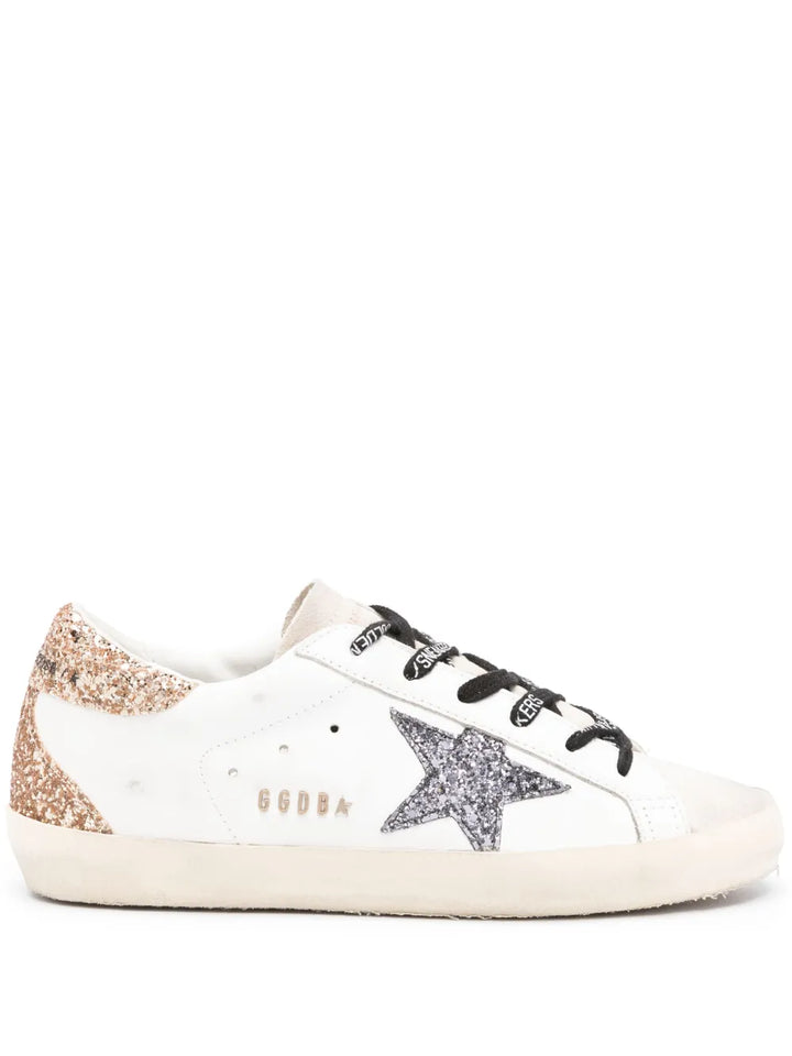 GOLDEN GOOSE 
Super-star leather upper glitter star heel and spur metal lettering