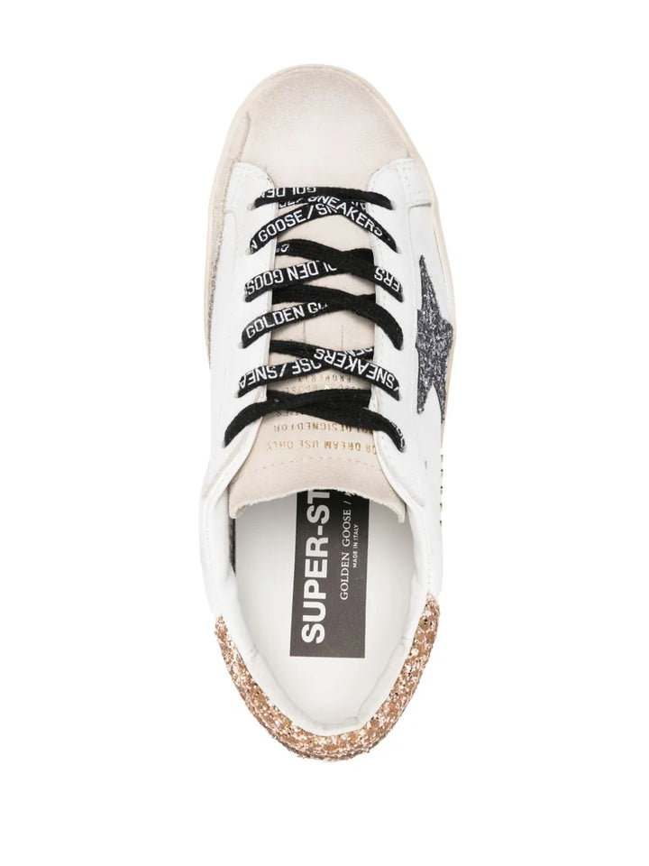 GOLDEN GOOSE 
Super-star leather upper glitter star heel and spur metal lettering